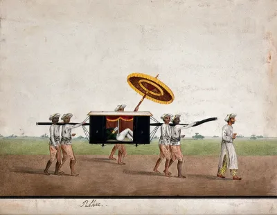 An European man relaxing and reading a book in a palkee carried by four men