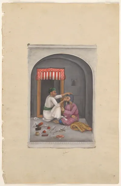 An eye-surgeon operating on a man
