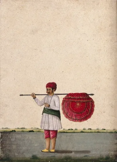 An Indian bearer holding a large, richly decorated fan or banner, horizontally on his shoulder