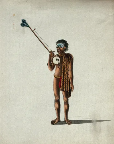 An Indian gypsy carrying an ektar (a one-stringed lute)