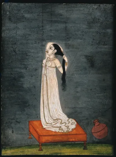 An Indian lady arranging her hair