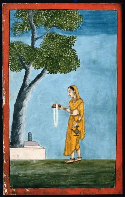 An Indian lady going to pray to a Shivling,a form of the god Shiva