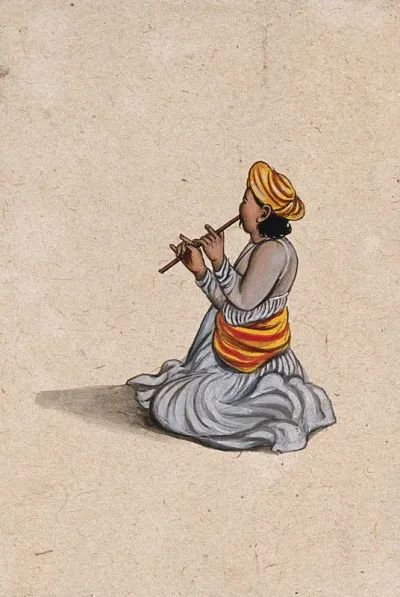 An Indian musician playing a bansuri (flute)