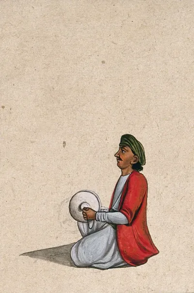 An Indian musician playing a pair of cymbals