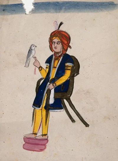 An Indian prince sitting on a chair with a bird on his finger