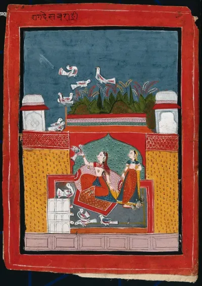 An Indian woman holding a bird while another looks on