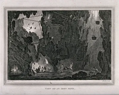 An iron mine and miners working
