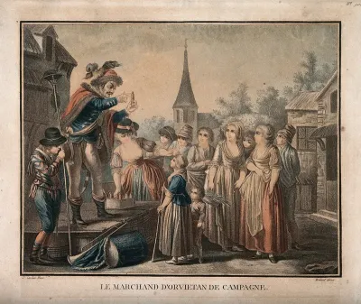 An itinerant medicine vendor selling his wares at a country market, assisted by a woman