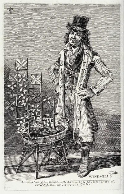 An itinerant salesman selling miniature windmills from a wicker basket before him