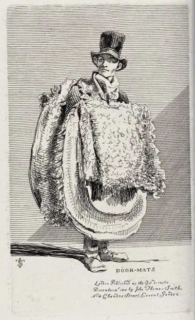 An itinerant salesman selling the doormats that are strapped to his chest