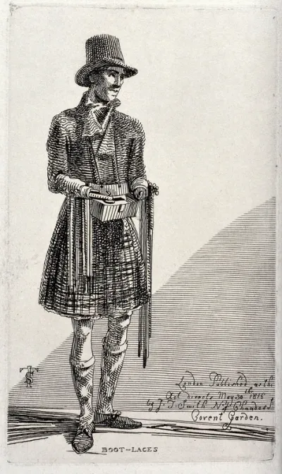 An itinerant salesman with artificial arms selling the bootlaces that hang from the hooks of his hands