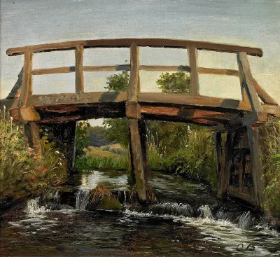 An old bridge over a stream.