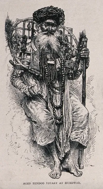 An old Hindu ascetic, or holy man, at Haridwar: seated, with a circular grating around his neck