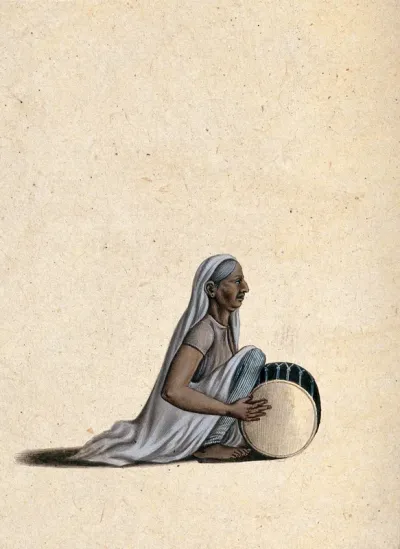 An old lady playing the dholak (Indian drum)