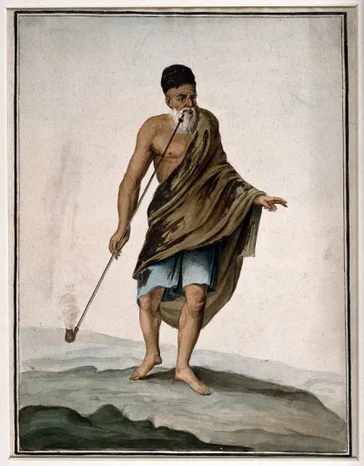 An old man in cloak and turban smoking a long pipe (chibouk)