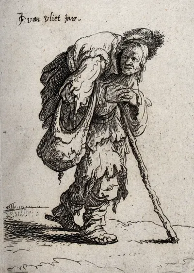 An old woman in ragged clothes carrying a huge load on her back