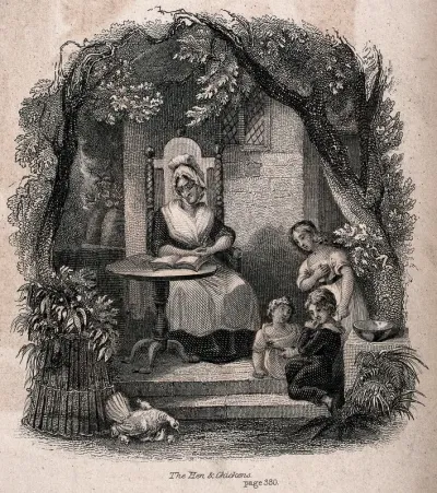 An old woman sits reading at a table outside a house while three children watch the hen with her chicks