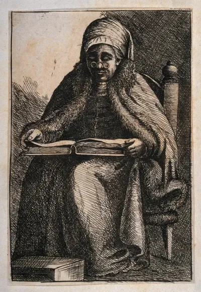 An old woman sitting and reading a book