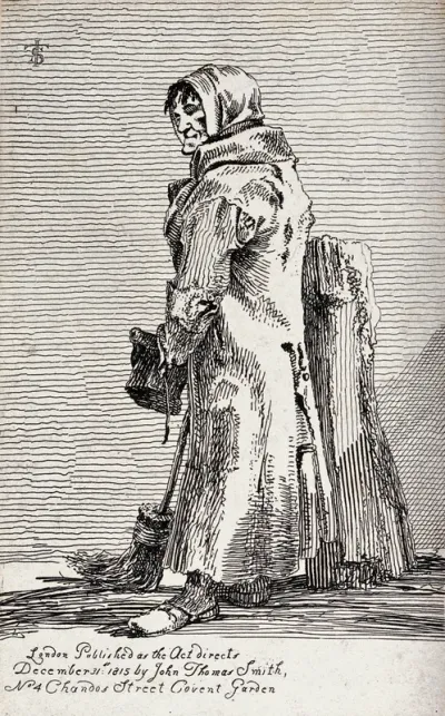 An old woman wearing a ragged coat leans against the stump of a tree holding a broom in her right hand and a hat in her left hand