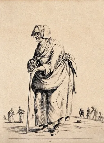 An old woman wearing ragged clothes is leaning on a stick