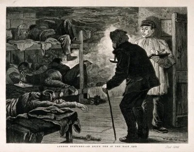 An opium den in London's East End with men lying on wooden bunks as a smoker enters