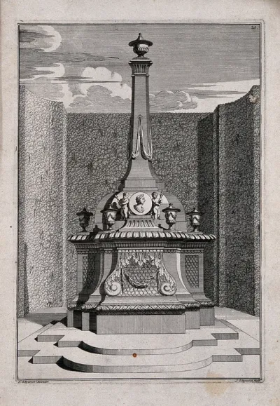 An ornate garden obelisk decorated with urns and cherubs
