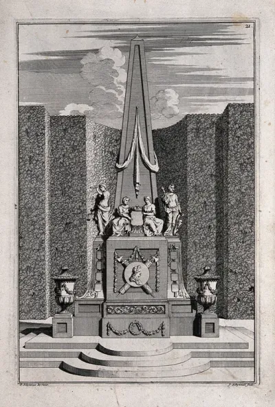 An ornate garden obelisk decorated with urns and statues