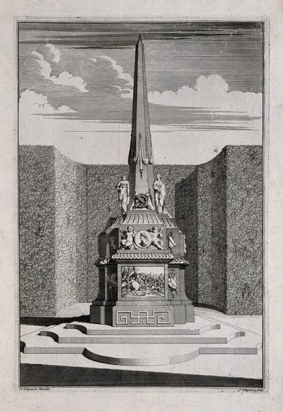 An ornate garden obelisk with a battle scene carved on the base