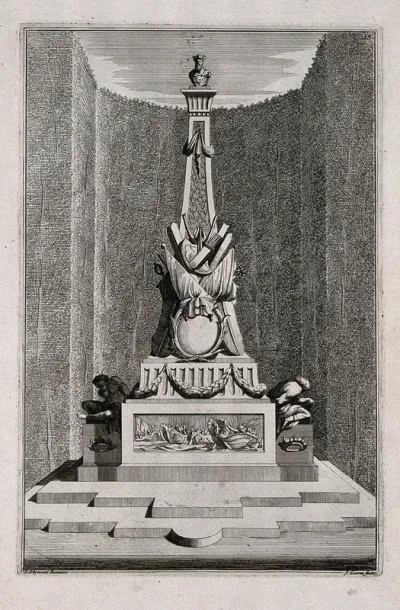 An ornate garden obelisk with a fleet of battle-ships carved on the base