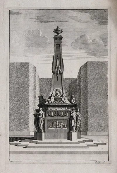 An ornate garden obelisk with a scene of figures round a large fire carved on the base