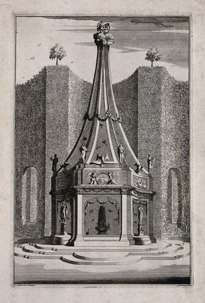 An ornate garden obelisk with statuettes of people and birds