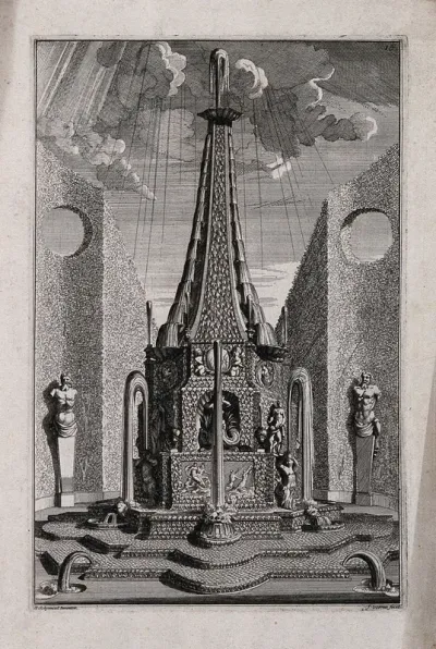 An ornate garden obelisk with water cascading down its sides