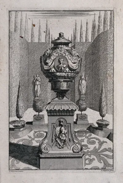 An ornate vase and pedestal with a bust and weapons carved on the side, in a classical garden