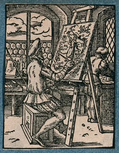 An painter at an easel in his studio, painting a picture of Abraham and Isaac