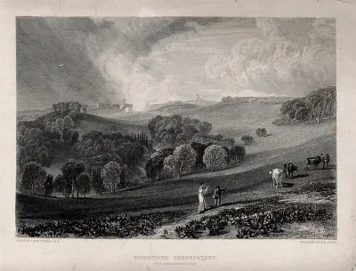 Astronomy: a woman walking on a hillside near below Brightling Observatory, East Sussex