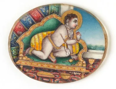 Bala Krishna sitting on a chair