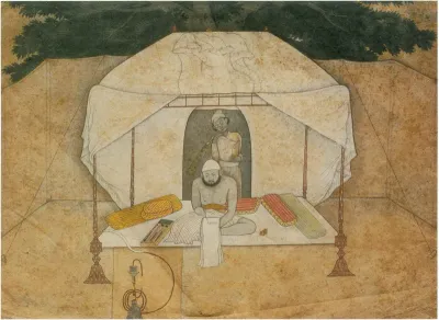 Balwant Singh Seated Writing on a Camp-Bed