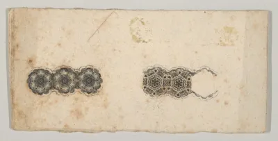Banknote motif: two bands of ornamental lathe work resembling florets and hexagons