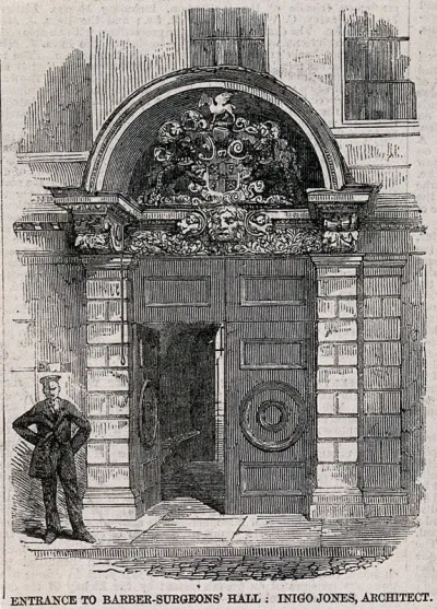 Barber-surgeons' Hall, Monkwell Street, London: the door of the hall, with a uniformed attendant standing to the left