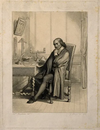 Blaise Pascal, seated at his desk