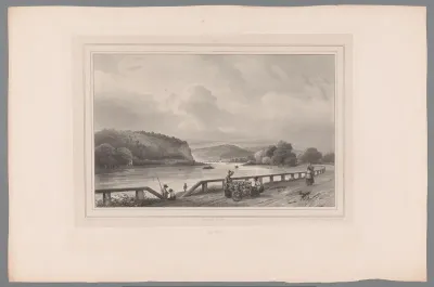 Bloemenverkoopster op een pad langs de Maas