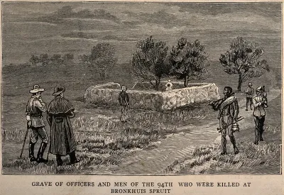 Boer War: the grave of those killed at Bronkhuis Spruit, with men standing round