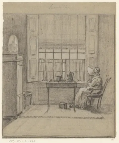 Breiende vrouw zit bij een koffietafel bij het raam