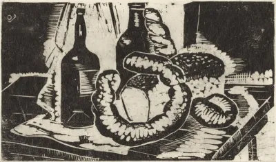 Brood, flessen en worst op een tafel