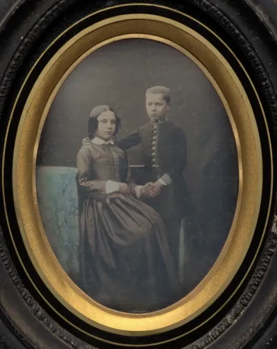 Brother and sister clasping hands