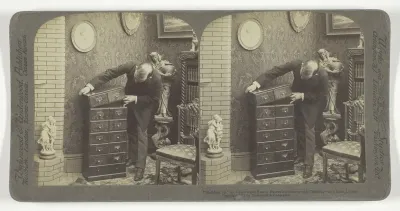 "Building up" an Underwood Patent Extension Stereograph Cabinet, - in a home Library.