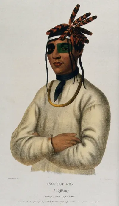 Caa-Tou-See, an Ojibwa chief, standing with arms crossed