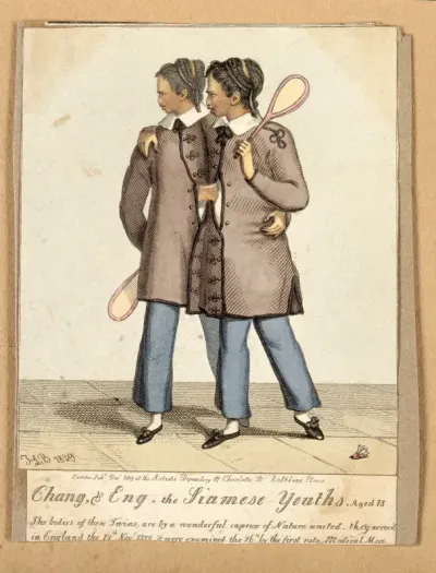 Chang and Eng the Siamese twins, aged eighteen, with badminton rackets