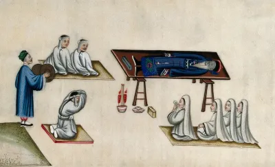 Chinese funeral customs: the body of an elderly man lies on a bier, attended by men and women mourners dressed in white, and by a monk clashing cymbals