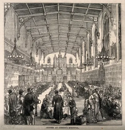 Christ's Hospital, London: the interior of the Hall with boys eating and adults looking on